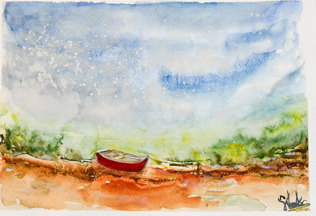 Red canoe on the shore