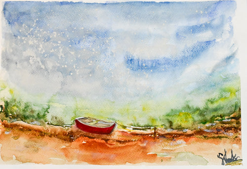 Red canoe on the shore